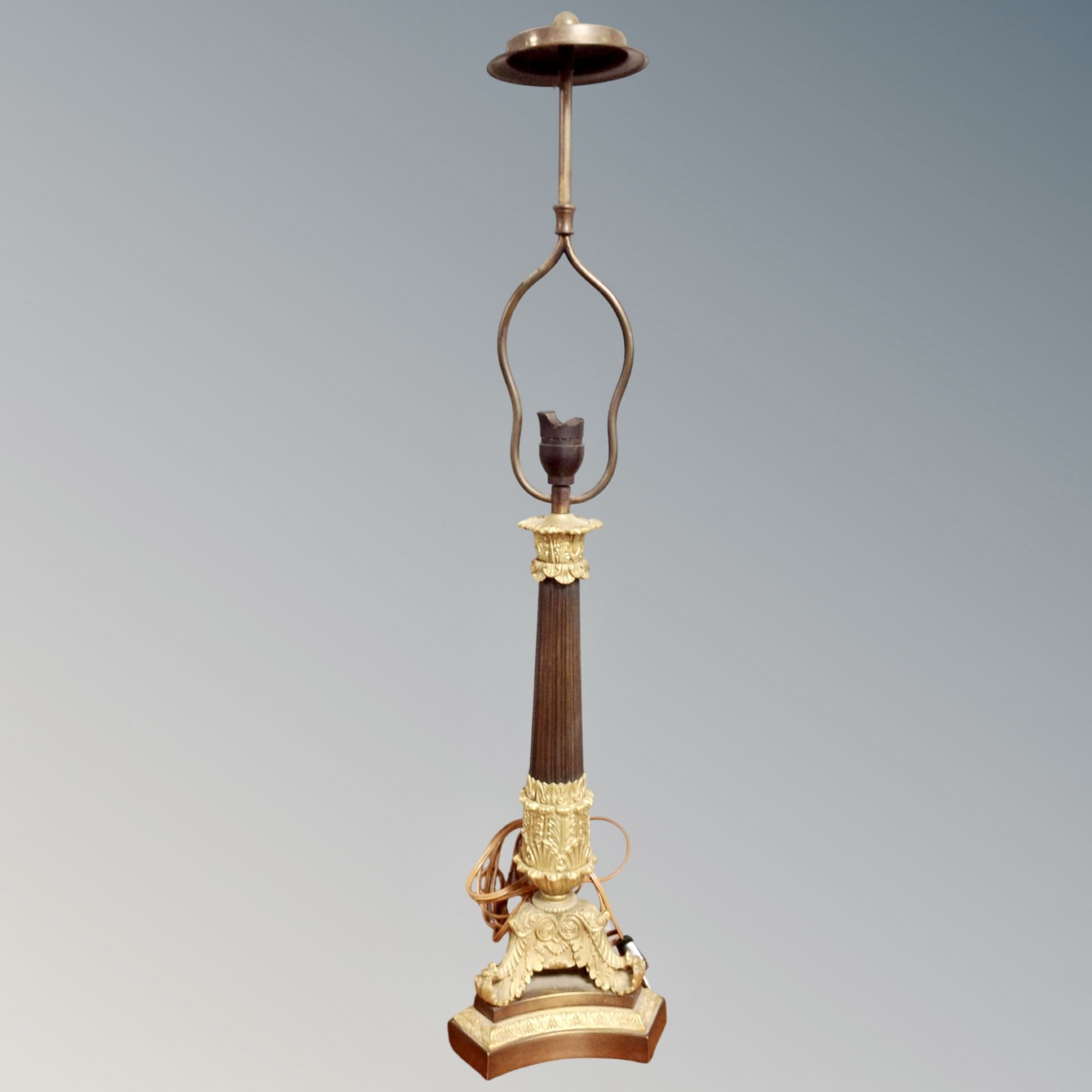 A decorative brass and marble column table lamp,