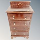 A Regency style four drawer mahogany chest