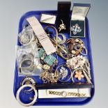 A tray of assorted costume jewellery, ornate dress brooches,