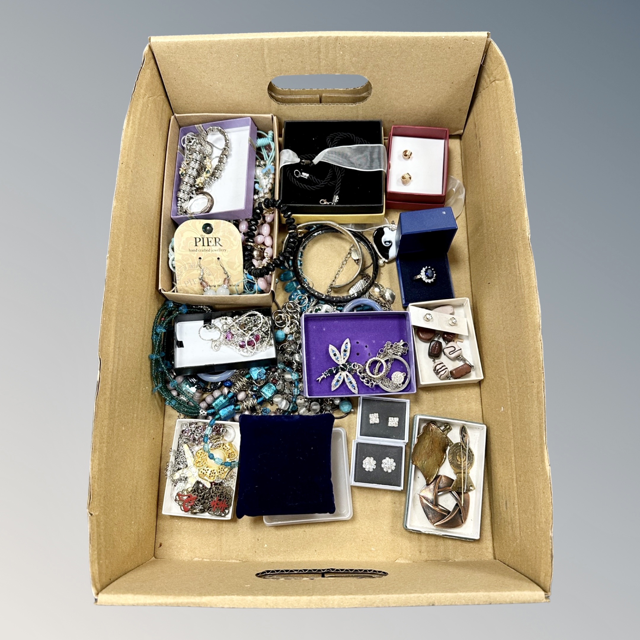A box of mixed costume jewellery, bangles, necklaces,