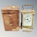 A brass carriage clock with key,