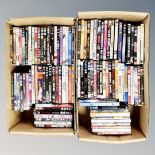 Two boxes containing approximately 100 dvds