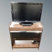 A Panasonic Viera 26 inch LCD TV with remote and a Philips hostess trolley