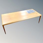 A 20th century Danish Silkeborg teak coffee table with tiled inset panel