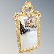 A contemporary gilt framed baroque style mirror