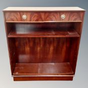 A Beresford and Hicks bookcase fitted with drawers