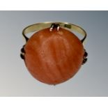 A yellow gold coral ring, size K, shank stamped 18k.