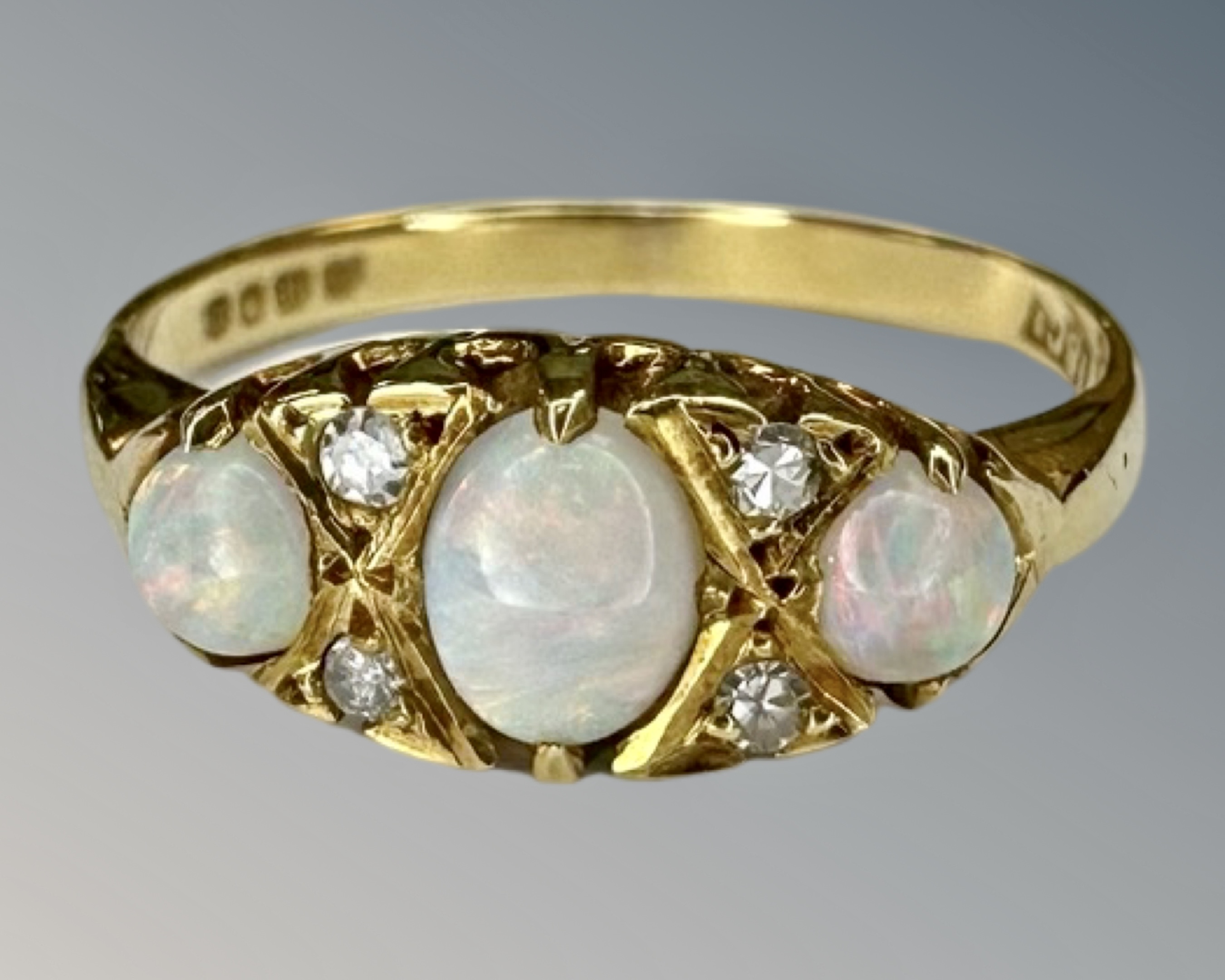 An antique 18ct gold opal and diamond ring, size L.