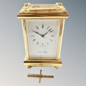 A brass eleven jewel carriage clock with key