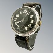 An Omega trench wristwatch, black dial with luminous Arabic numerals and hands, subsidiary seconds,