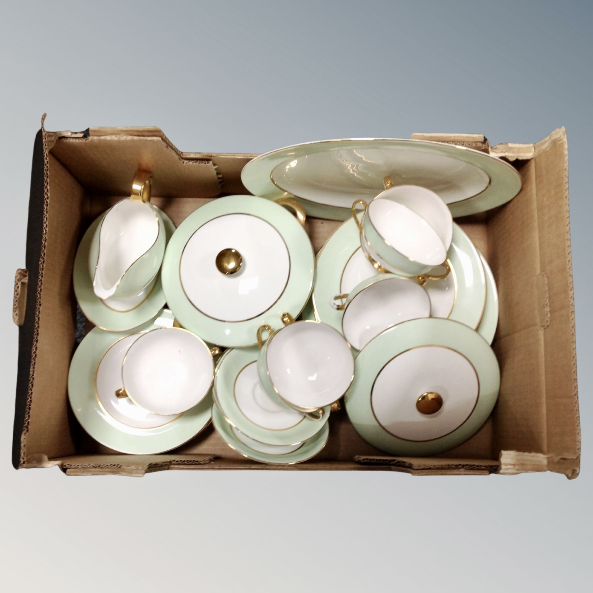A box of Imperial China tea and dinner ware with 22ct gold finish