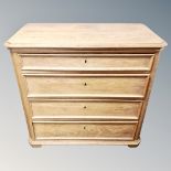 A 19th century oak four drawer chest, height 87 cm, width 95 cm, depth 49 cm.