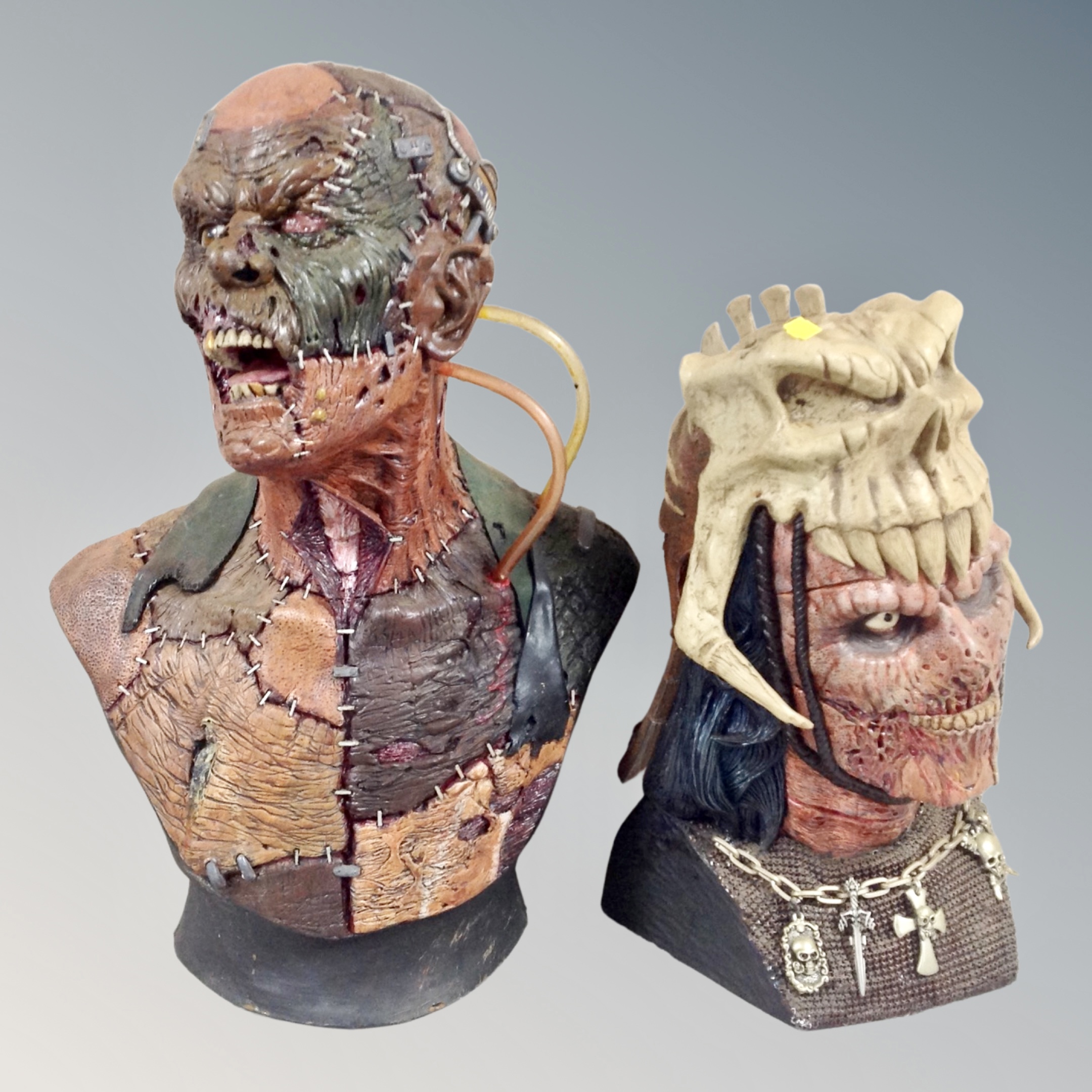 Two contemporary horror busts, tallest 53cm, with two framed prints of The Predator,