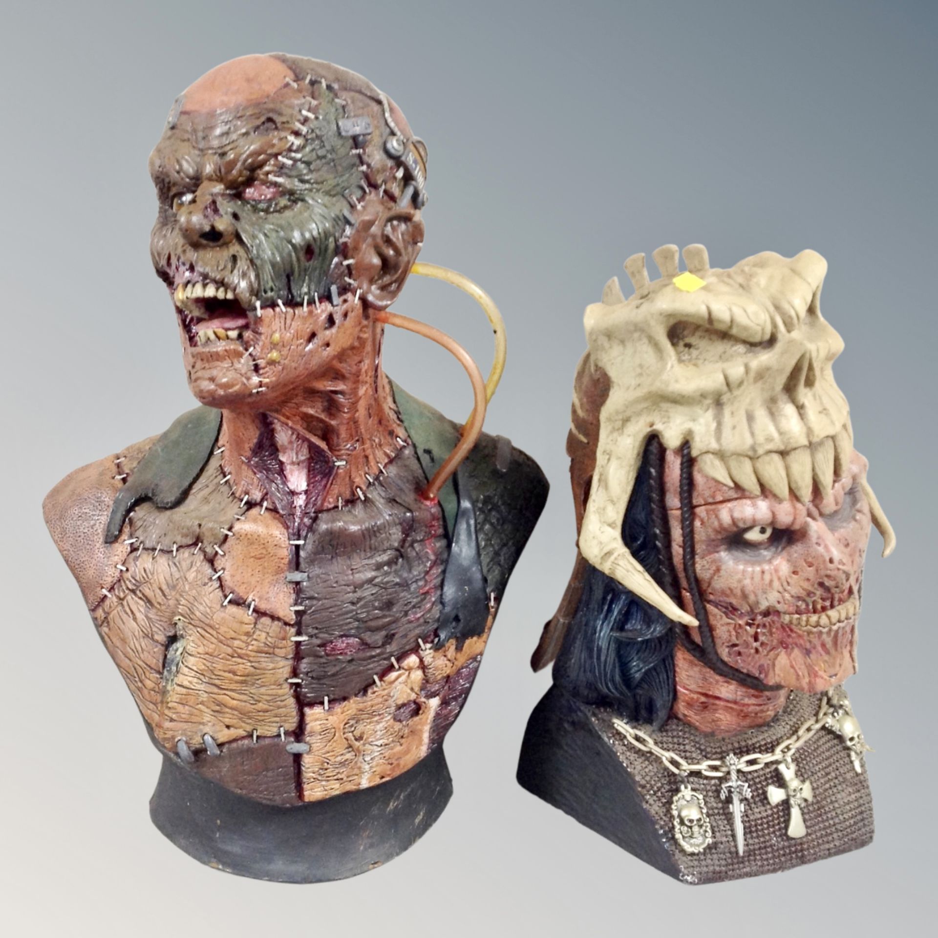 Two contemporary horror busts, tallest 53cm, with two framed prints of The Predator,