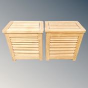 A pair of teak storage stools