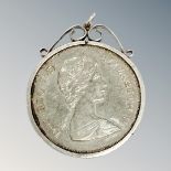 A commemorative coin in silver mount