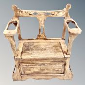 An Edwardian oak stick stand / hall seat