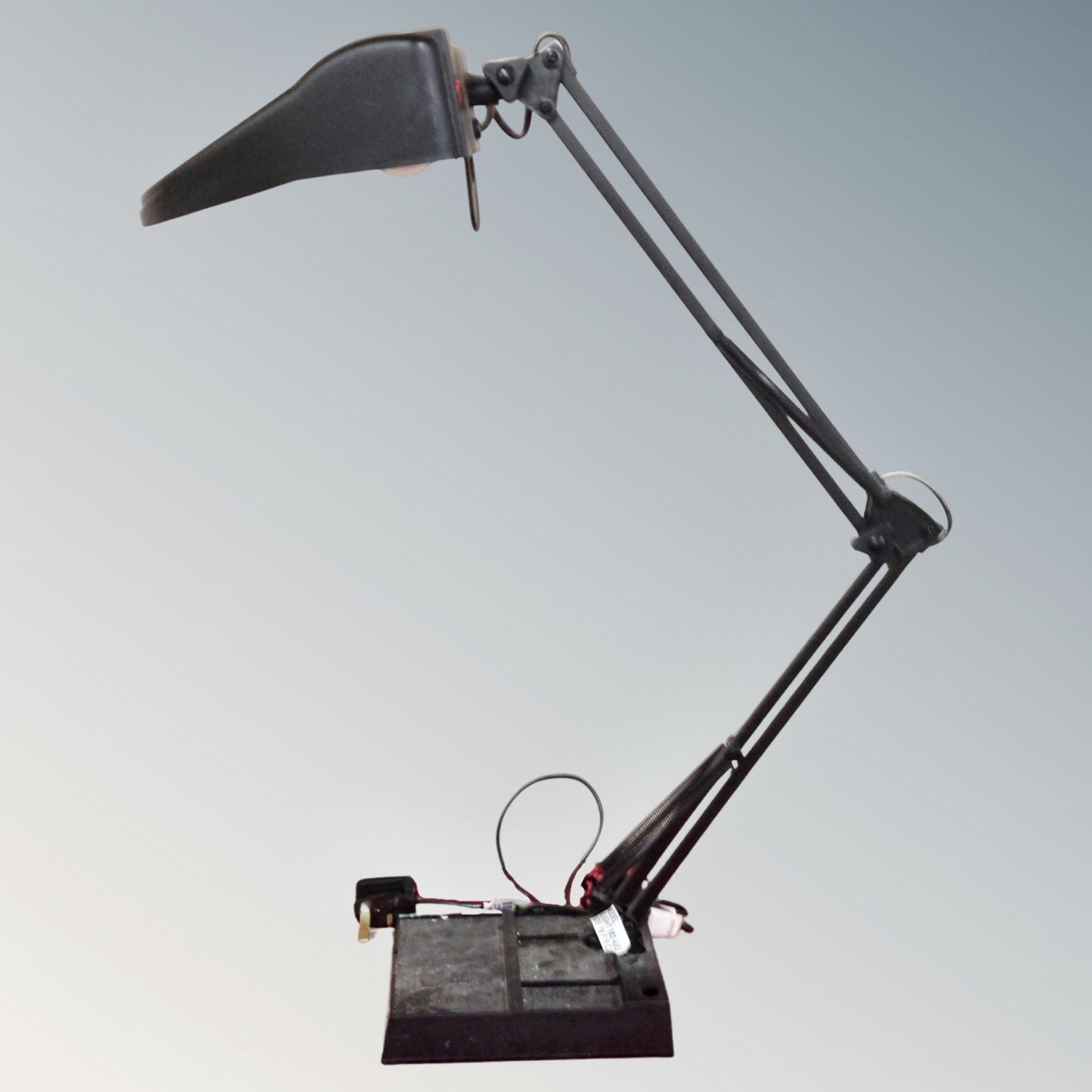 An angle poised reading lamp