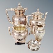 A four piece good quality silver plated tea service together with a tea strainer on stand