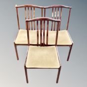 A set of six Scandinavian rail backed dining chairs in mahogany finish