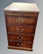 A two drawer mahogany finish office filing chest with slide and green leather inset panel,