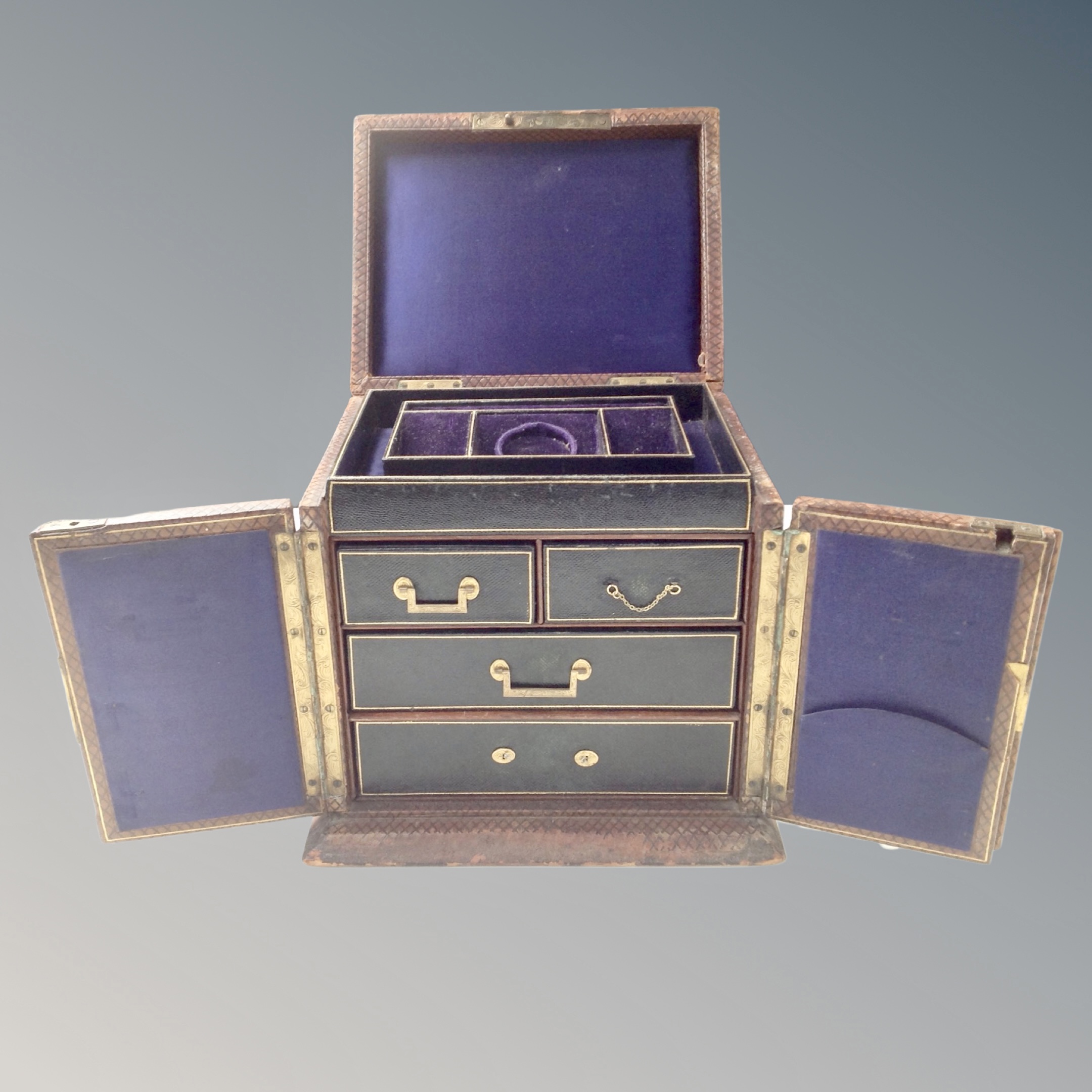 A 19th century leather bound fitted jewellery casket