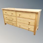 A contemporary six drawer block chest together with a matching five drawer chest