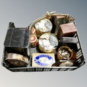 A crate of leather jewellery boxes, vintage tins containing buttons,