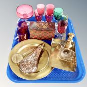 A tray of 20th century coloured glass ware, wooden card box, antique metal ware, shot flask, scoup,