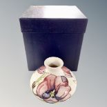 A Moorcroft pink magnolia squat bulbous vase with original box