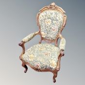 A carved walnut framed Louis XV style chair in tapestry fabric