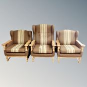A pair of 20th century Danish blond oak lounge chairs in brown striped fabric together with