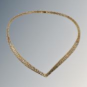 A multi tone silver gilt necklace