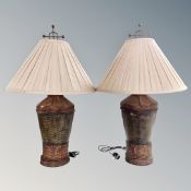 A pair of contemporary metal table lamps with silk shades