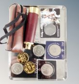 A pocket telescope in leather case together with assorted commemorative coins and crowns