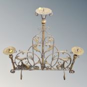 A wrought metal three-way candleholder/fire screen, width 78 cm, height 80 cm.