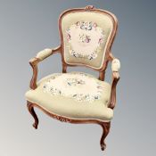 A carved beech framed salon chair in tapestry fabric