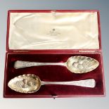 A pair of silver berry spoons, London marks, in fitted case.