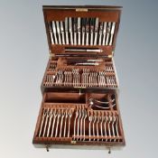 An Edwardian oak canteen fitted a drawer containing Sheffield plate and stainless steel cutlery