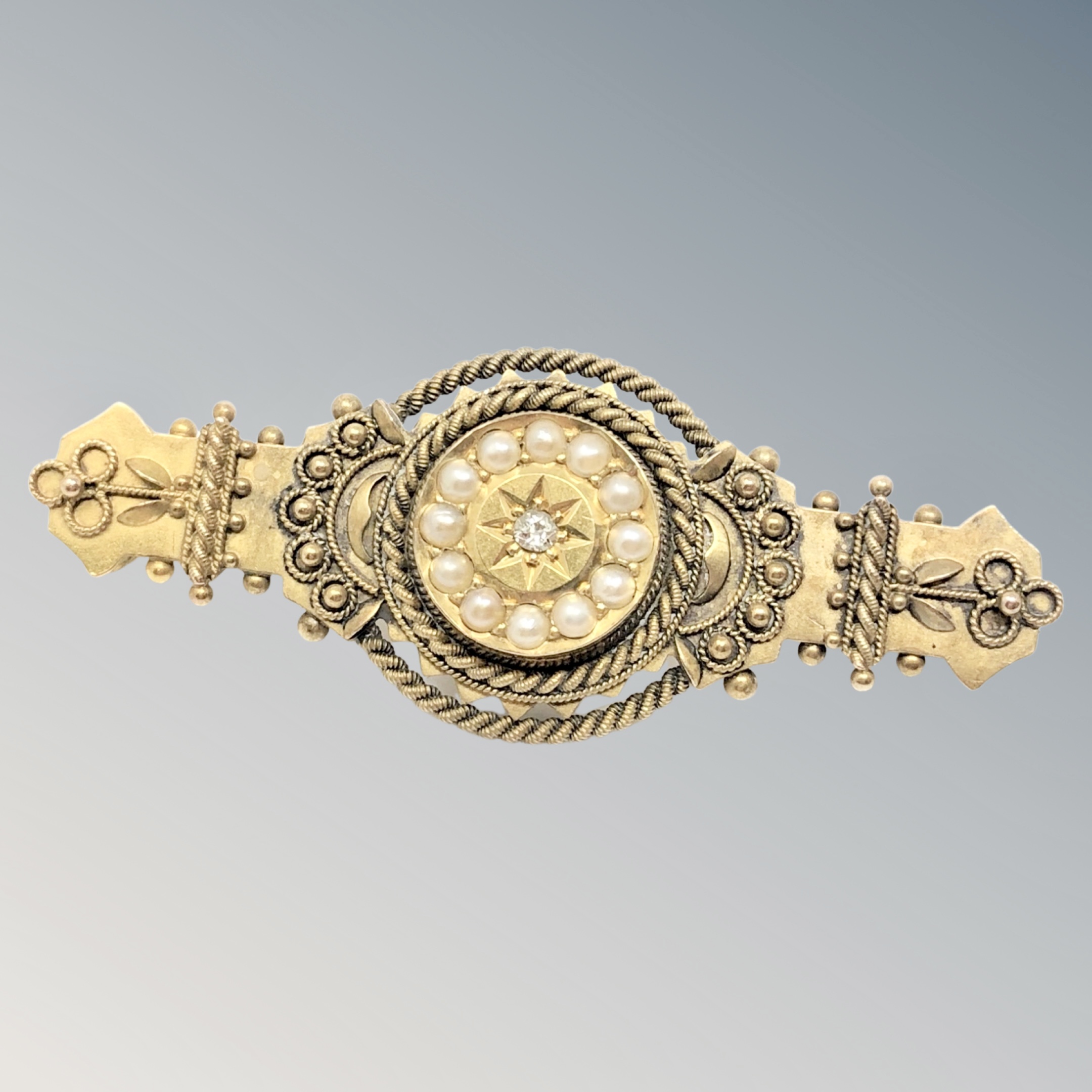 An antique 15ct gold pearl and diamond bar brooch CONDITION REPORT: 4.