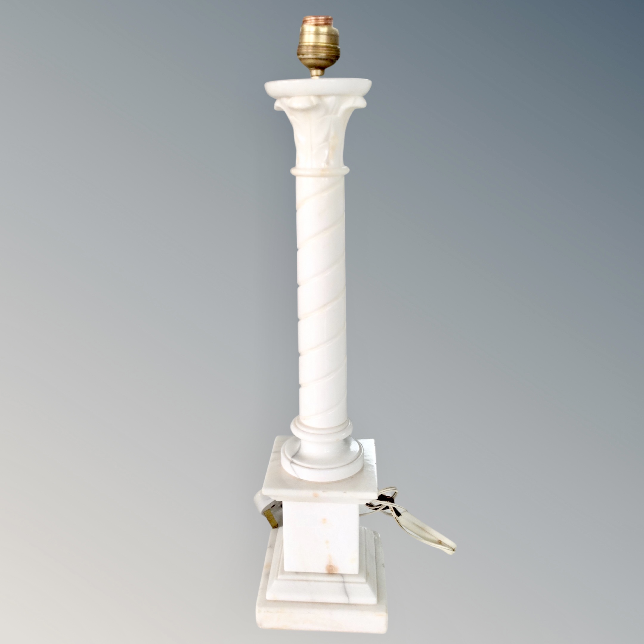 A white marble column table lamp,