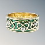 A silver gilt and enamel ring