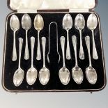 A set of twelve silver tea spoons with sugar tongs, Sheffield 1931.