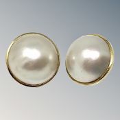 A pair of yellow gold mounted mabe pearl earrings CONDITION REPORT: One lacks post