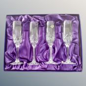 A set of four Edinburgh Crystal champagne flutes,