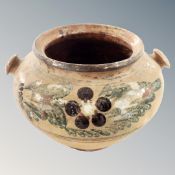 An antique glazed pottery planter,