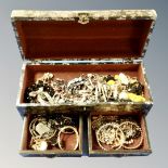 A floral domed topped jewellery chest containing good quality costume jewellery