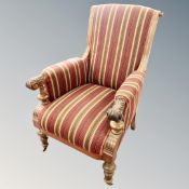 A 19th century carved walnut armchair in striped fabric