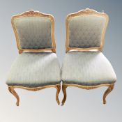 A pair of Louis XV style armchairs on cabriole legs
