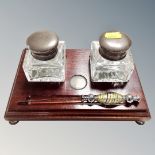 A desk stand with two silver topped inkwells, Birmingham marks, 2001,